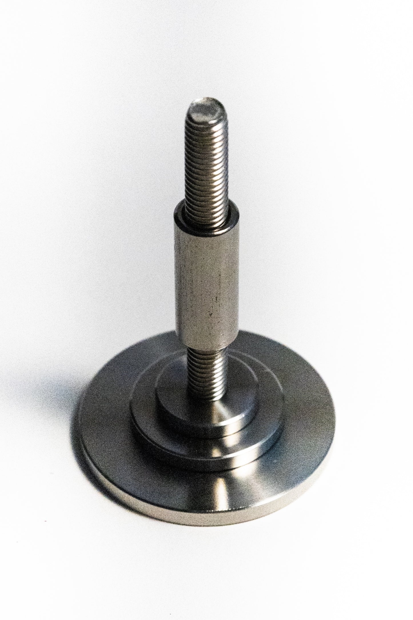 Metal screw with a round base on a white background