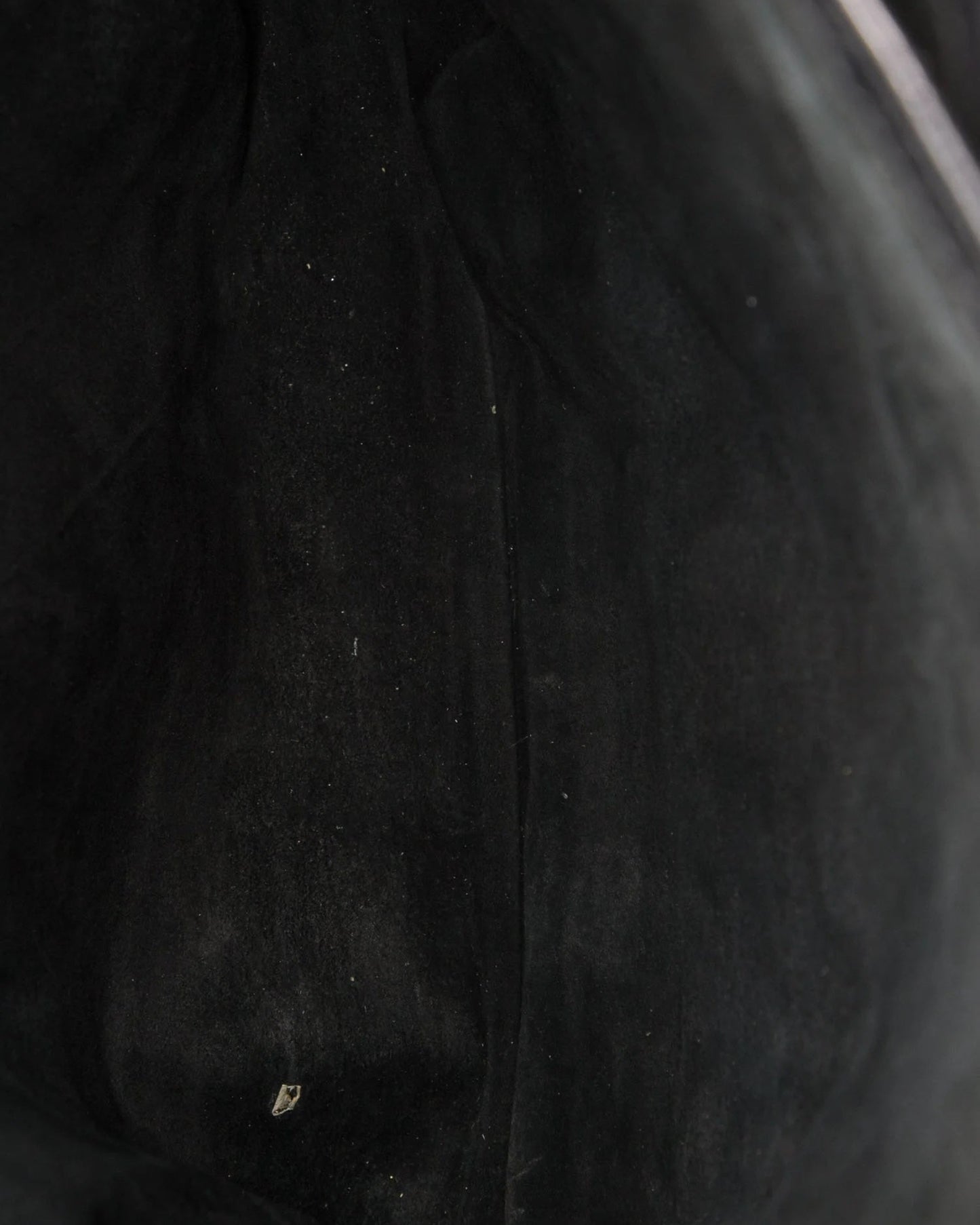 Close-up of a textured black fabric surface
