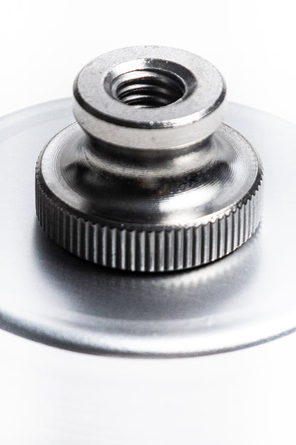 Metallic knob or旋钮 on a white background