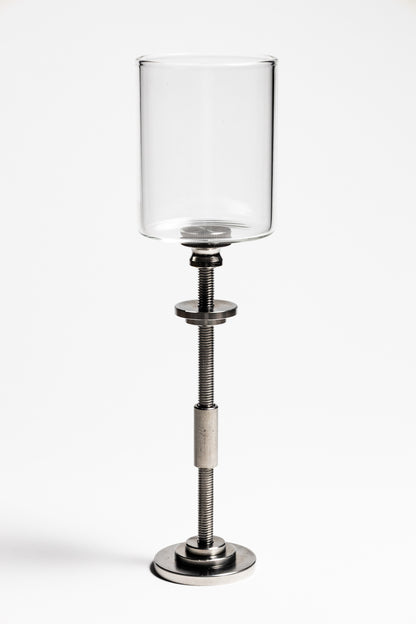 Clear glass candle holder on a metal stand with adjustable height on a white background