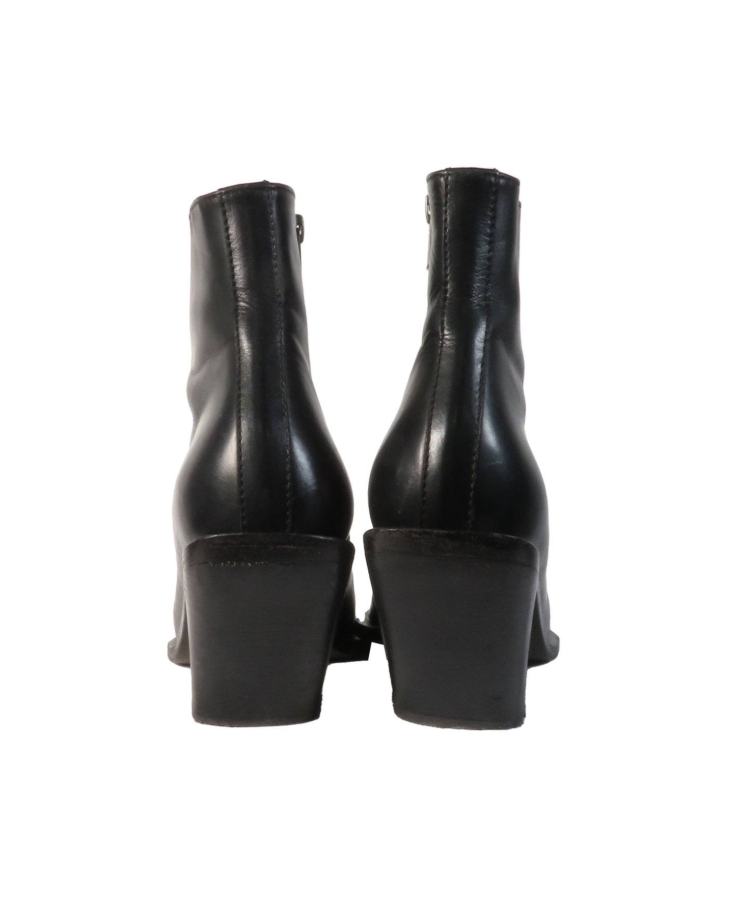 Black leather ankle boots on a white background