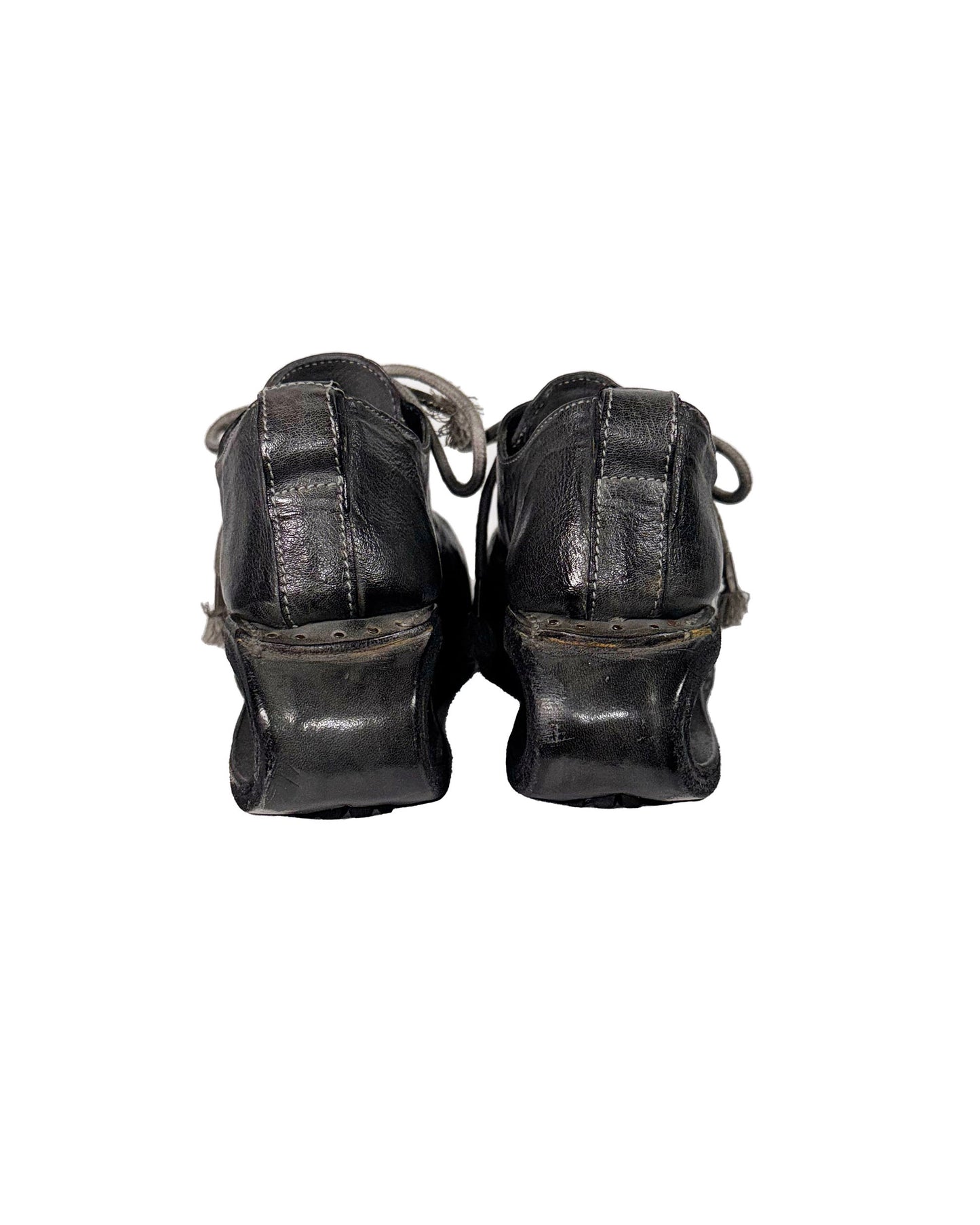 Pair of black leather shoes on a white background