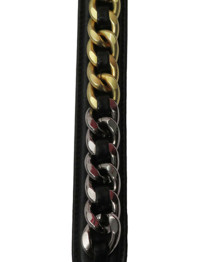 Close-up of a black leather strap with gold and silver chain links on a white background