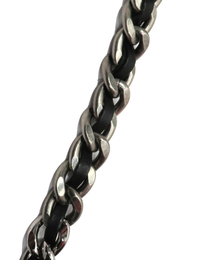 Close-up of a braided metal chain on a white background