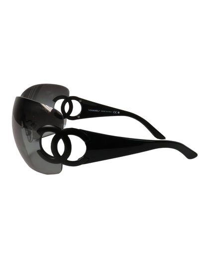Black sunglasses with a reflective surface on a white background