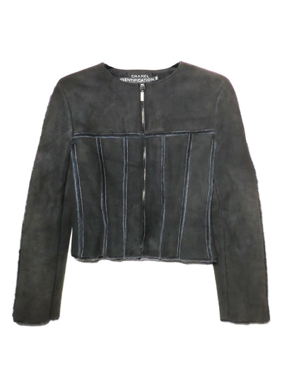 Black leather jacket with Chanel branding on a white background