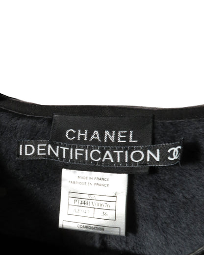 Chanel identification label on a garment with a white background