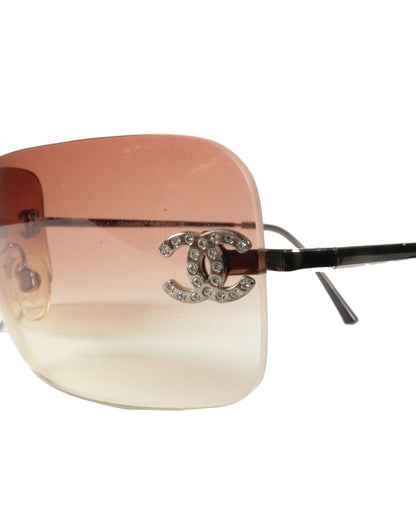 Sunglasses with a Chanel logo on a white background