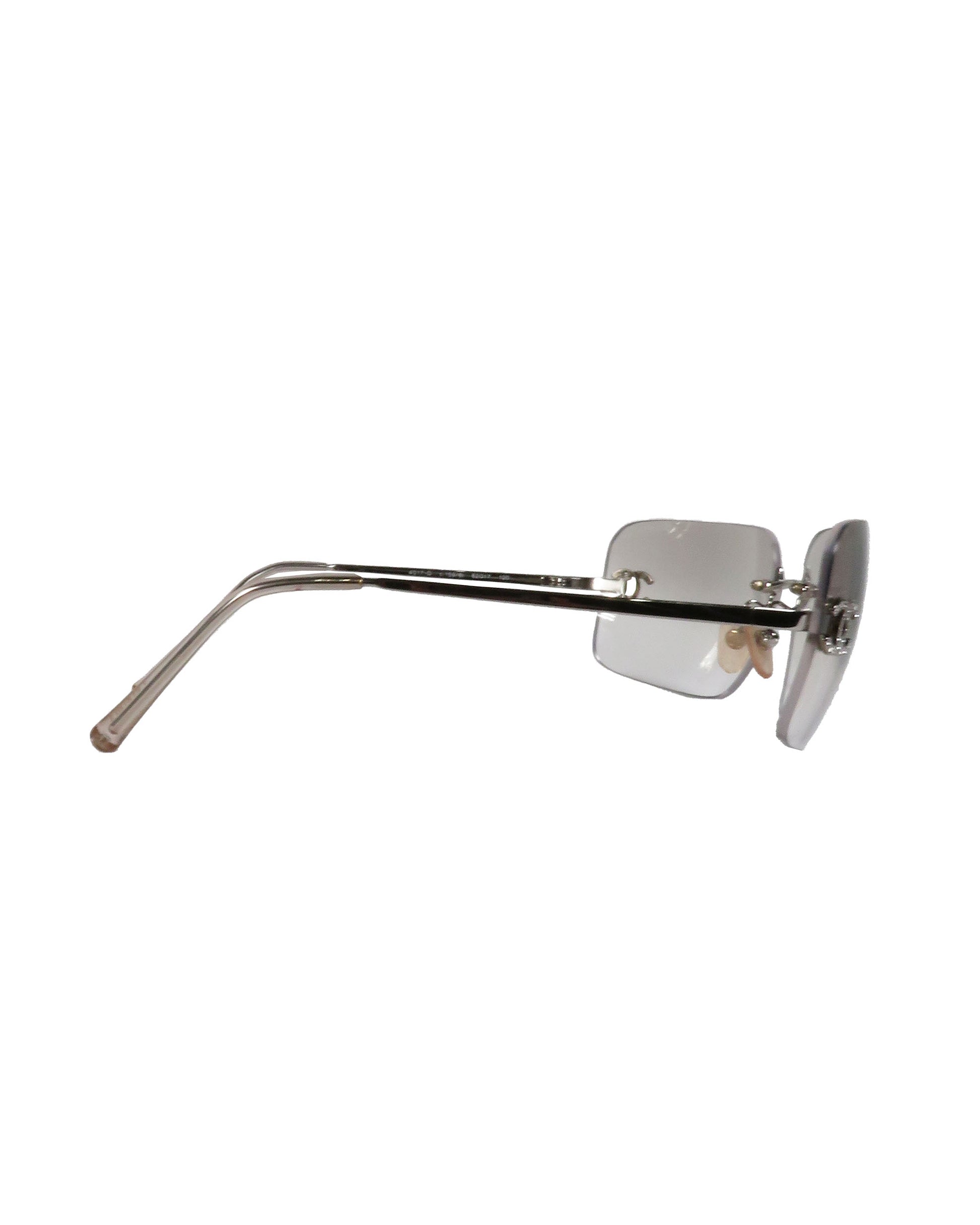Silver sunglasses with a thin frame on a white background