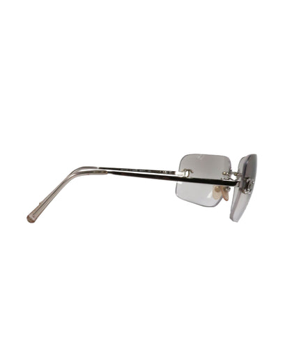Silver sunglasses with a thin frame on a white background