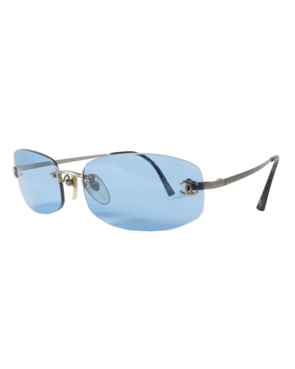 Sunglasses with blue lenses and thin frame on a white background