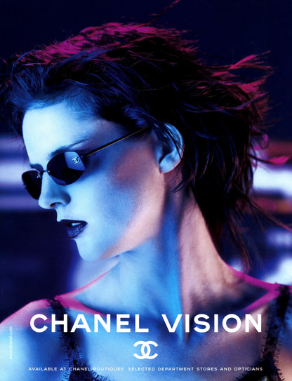 Person wearing sunglasses with a stylized 'Chanel' logo and text in the foreground.