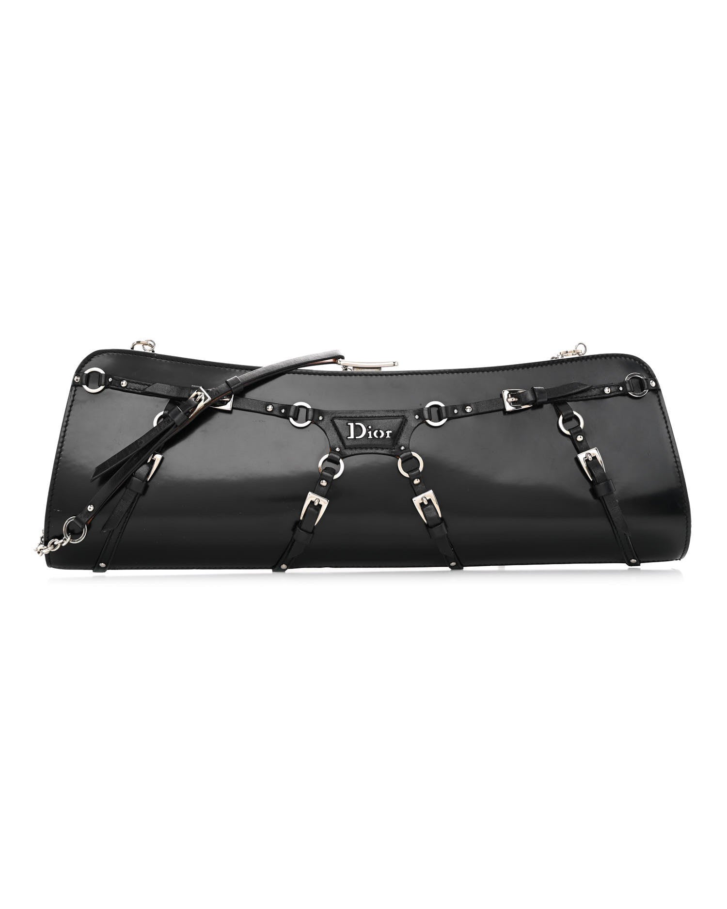 Black patent calfskin clutch with buckle and strap bondage detailing, silver-tone hardware, and a chain strap.