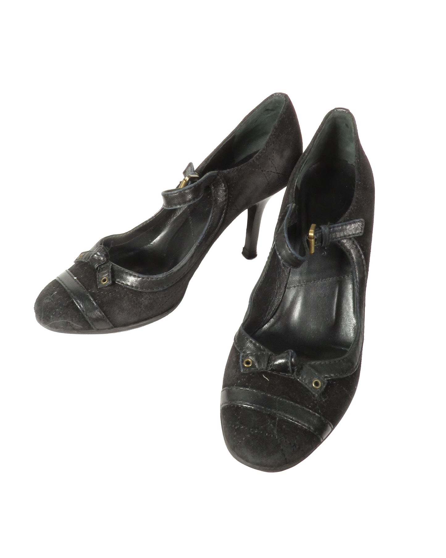 Pair of black high-heeled shoes on a white background