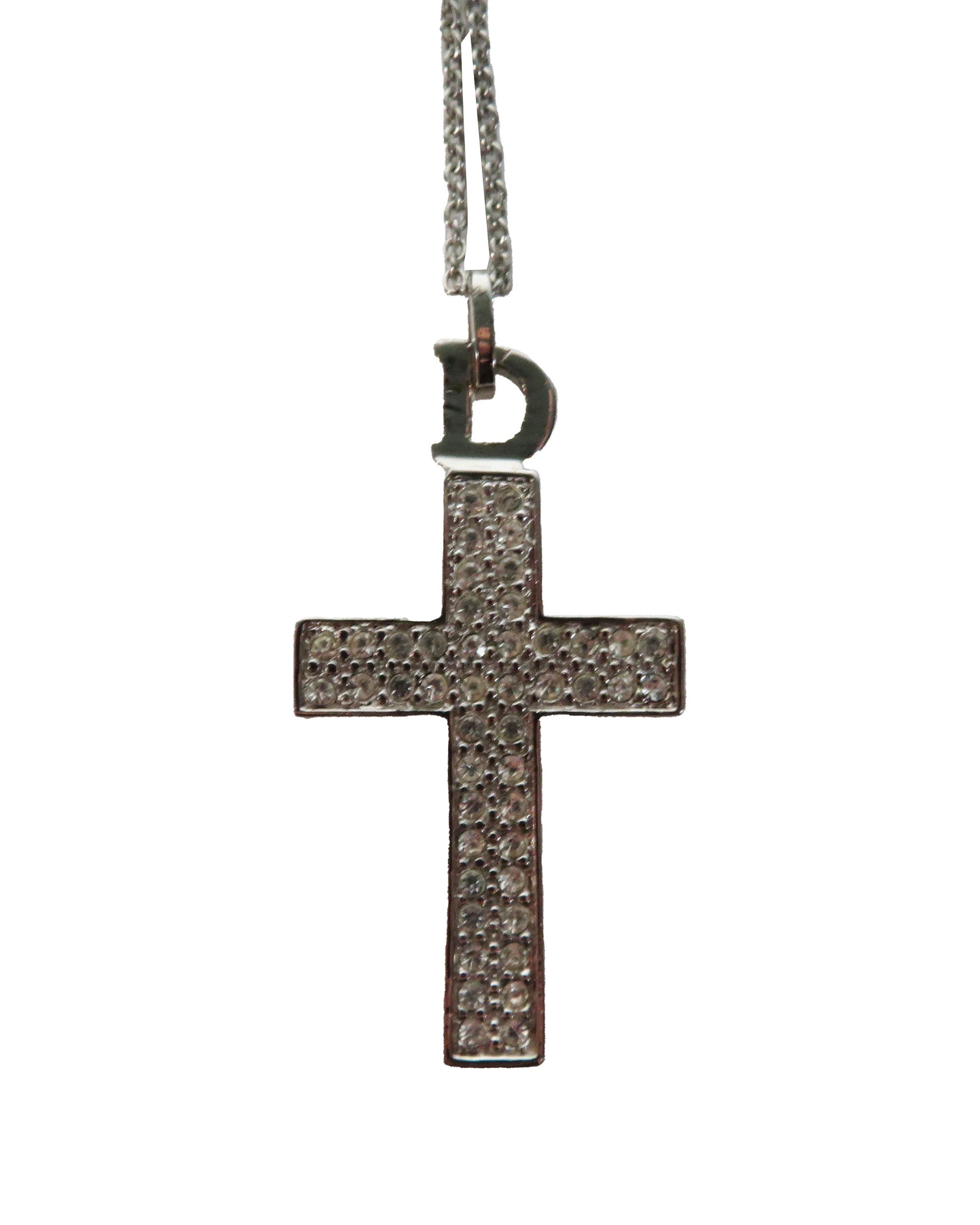 Cross-shaped pendant with chain on a white background