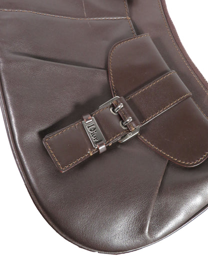 Close-up of a brown leather bag with a silver buckle on a white background