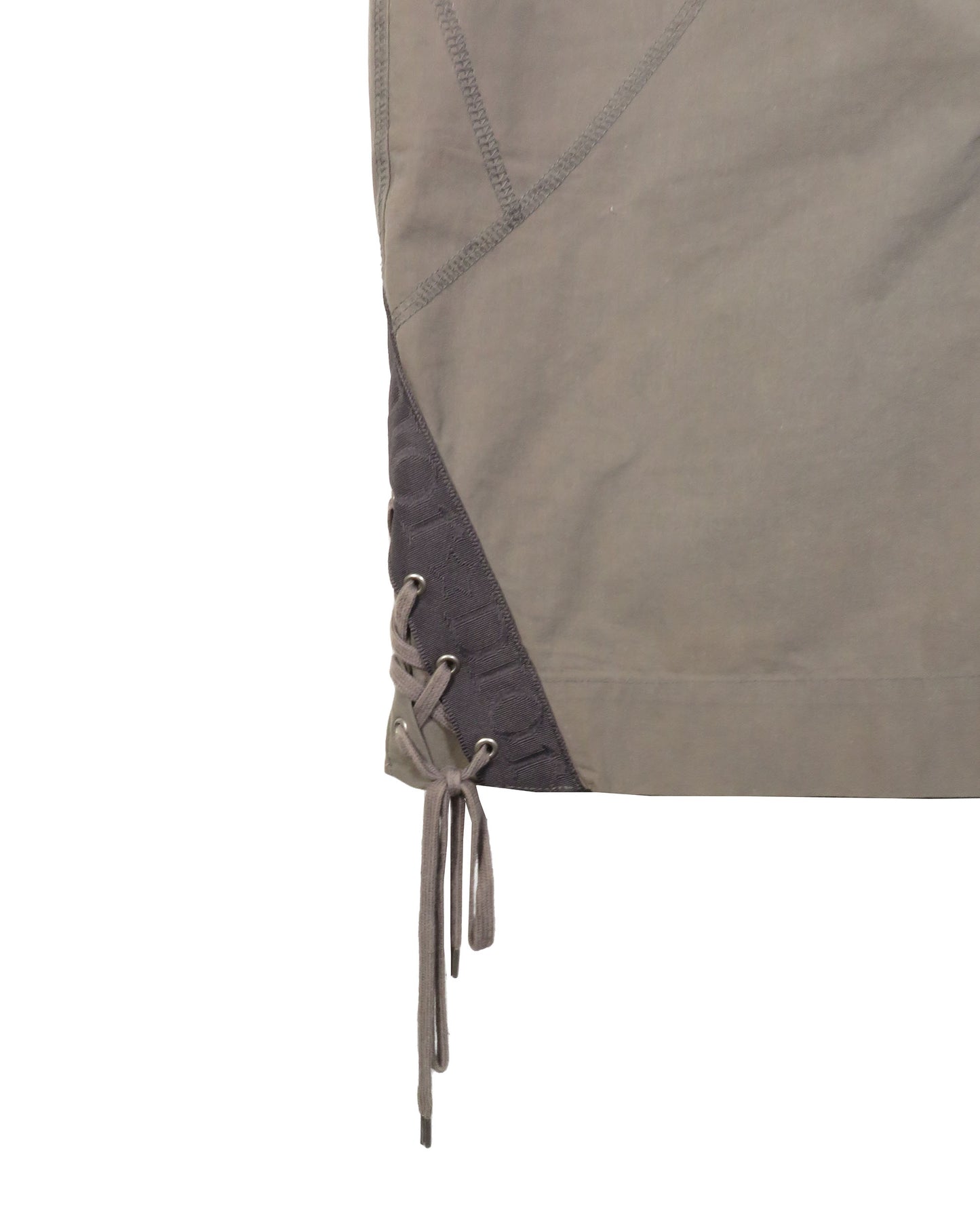 Close-up of a brown jacket with lace-up front on a white background