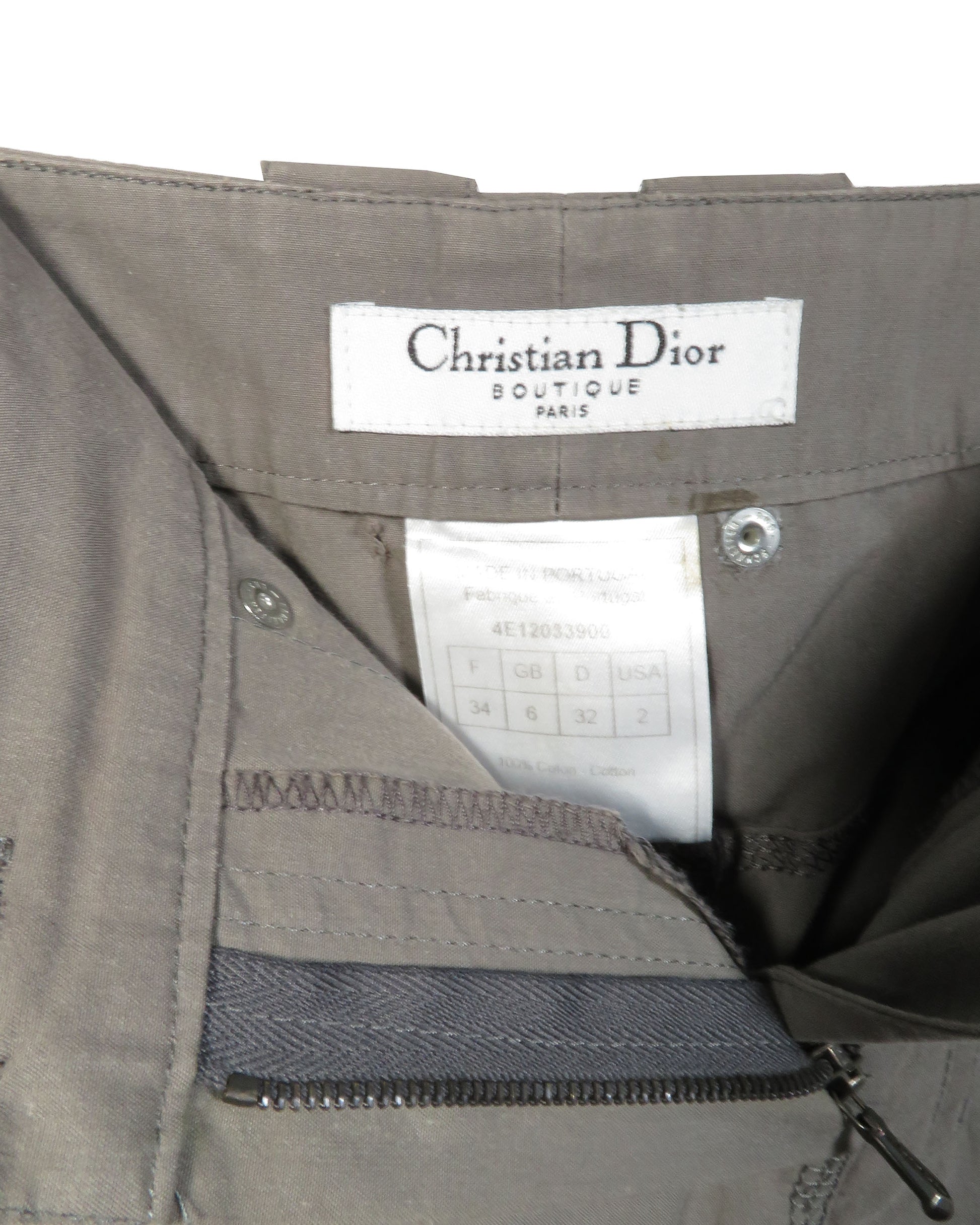 Gray jacket with Christian Dior label on a white background