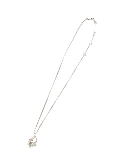 A silver-tone Christian Dior pendant necklace with a central logo pendant and star motifs, featuring small crystal accents.