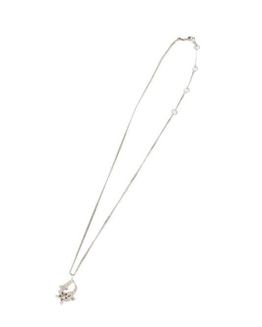 A silver-tone Christian Dior pendant necklace with a central logo pendant and star motifs, featuring small crystal accents.