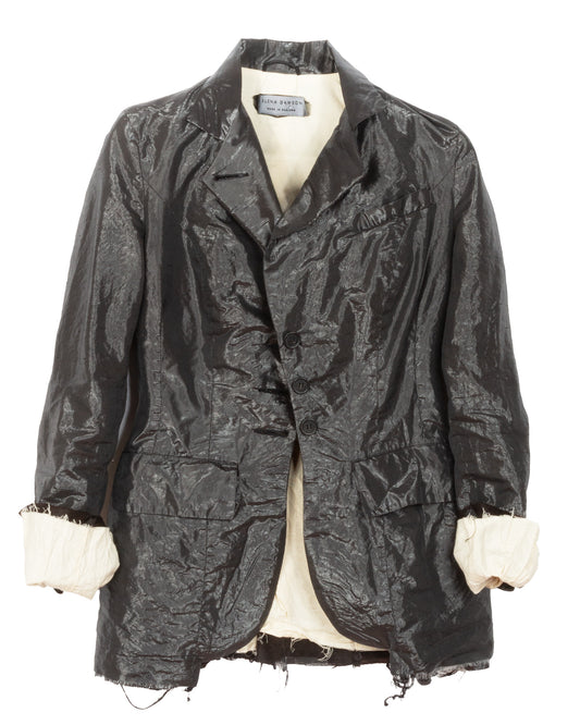 Dark patterned jacket on a mannequin with a white background