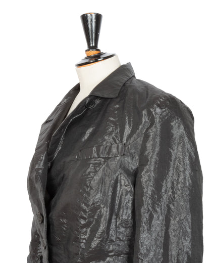 Black textured jacket on a mannequin against a white background