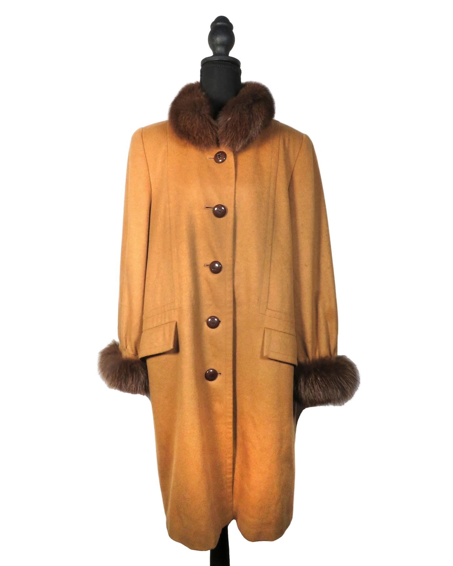 Brown coat with fur trim on a mannequin against a white background