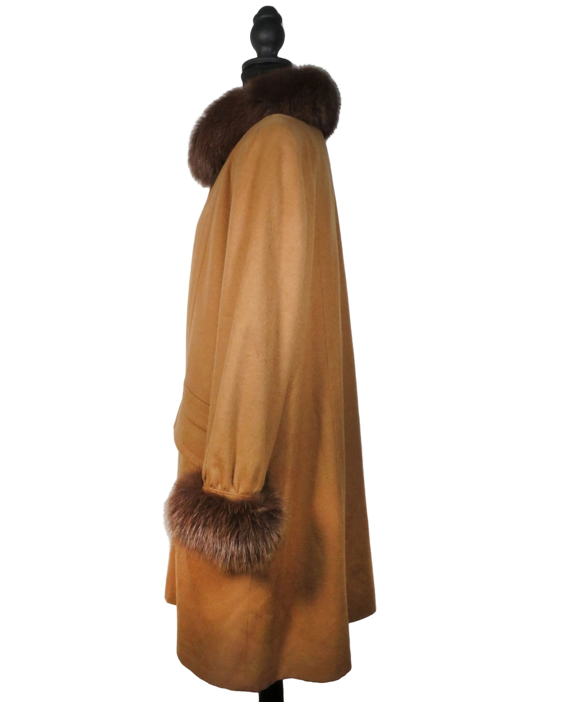 Brown coat with fur trim on a mannequin against a white background