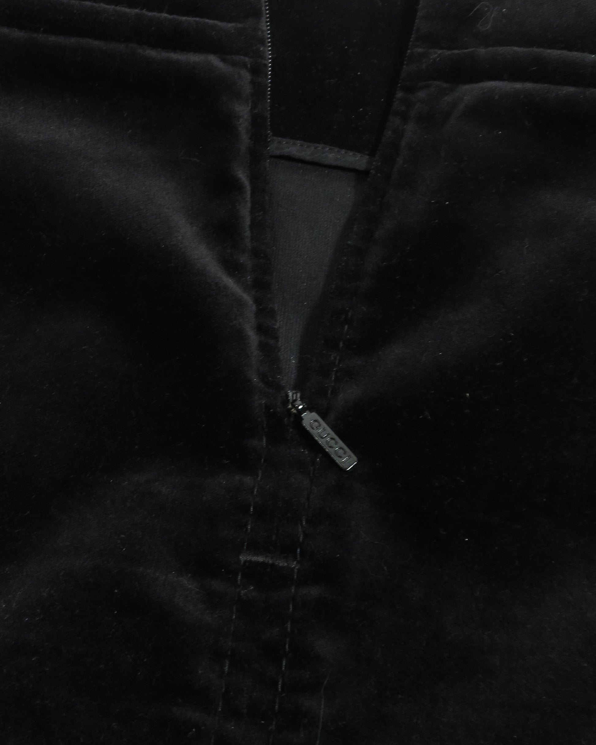 Close-up of a black jacket with a zipper