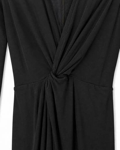 Black dress with a knot detail on a white background