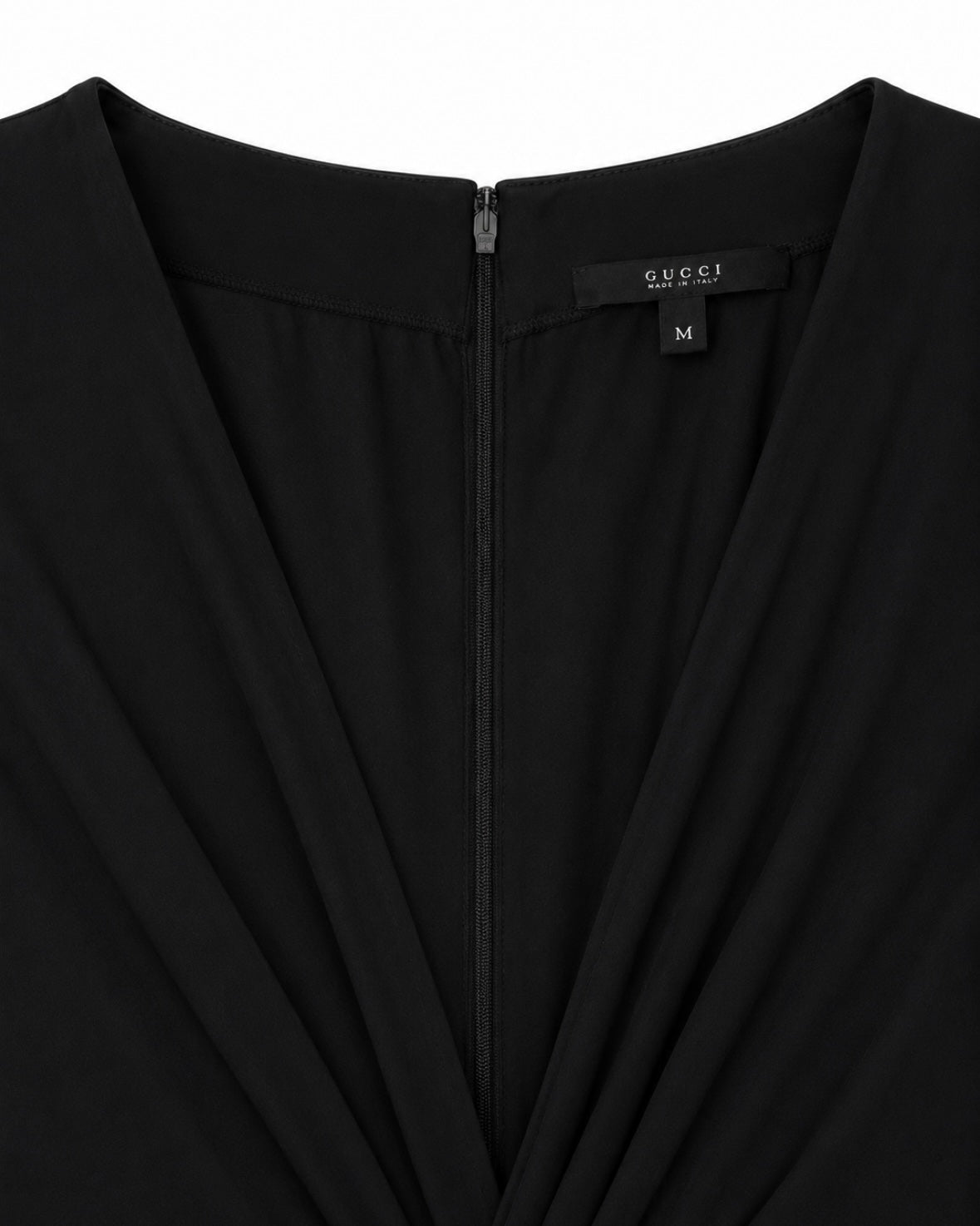 Black garment with Gucci label on a white background