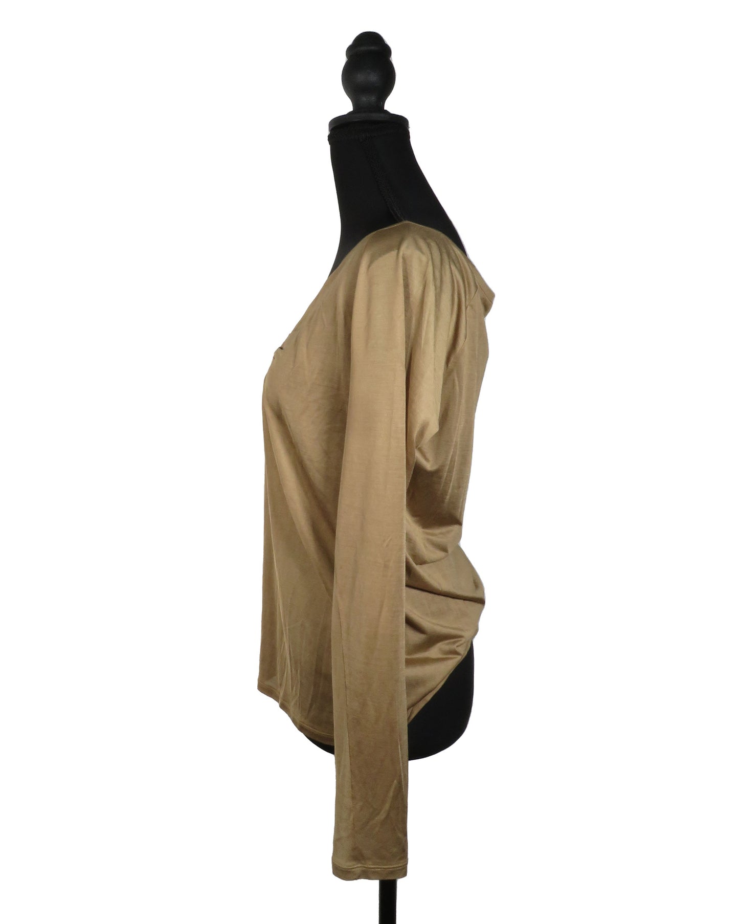Beige long-sleeve top on a mannequin against a white background