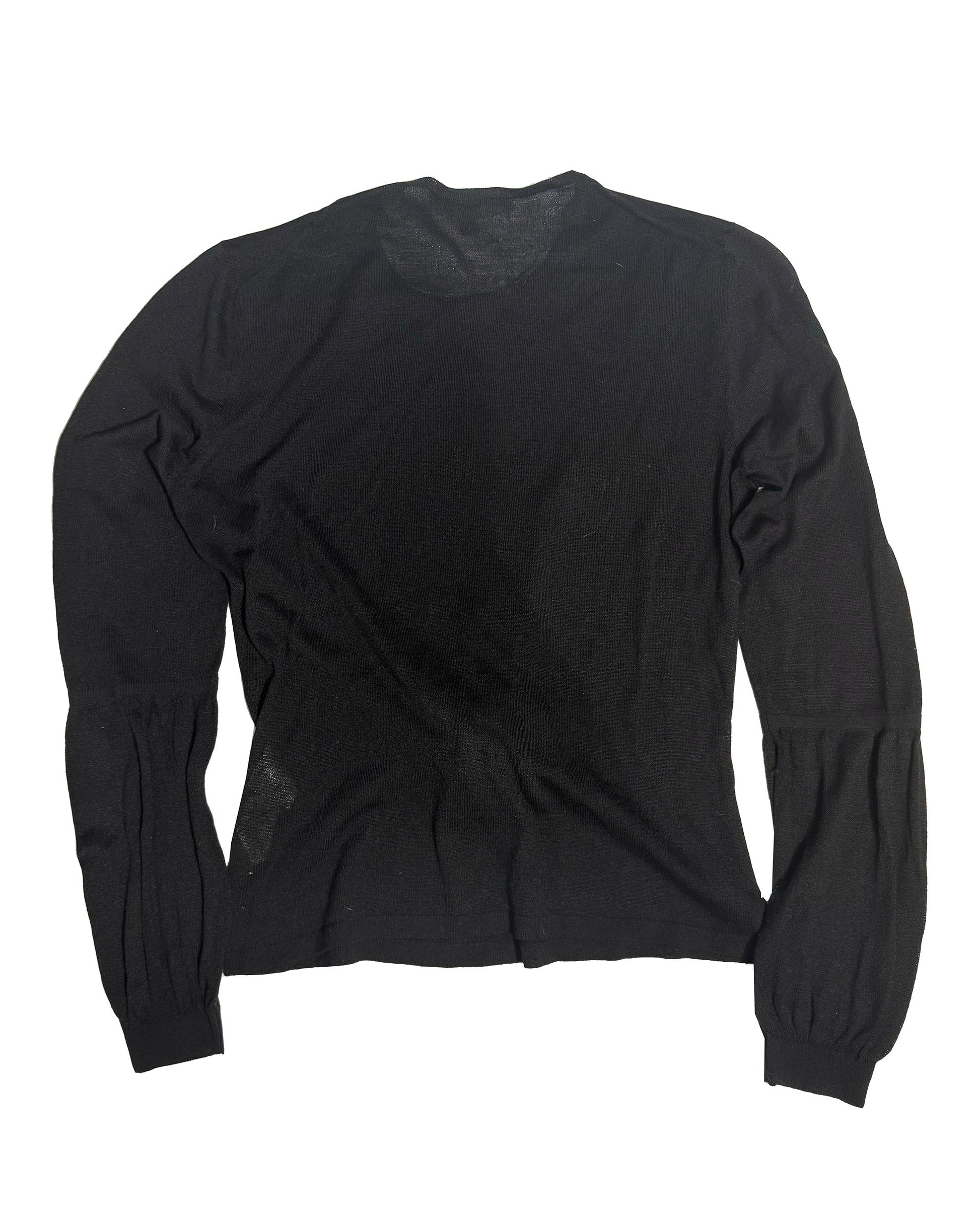 A black long-sleeve knit top with gathered sleeves, laid flat against a white background.