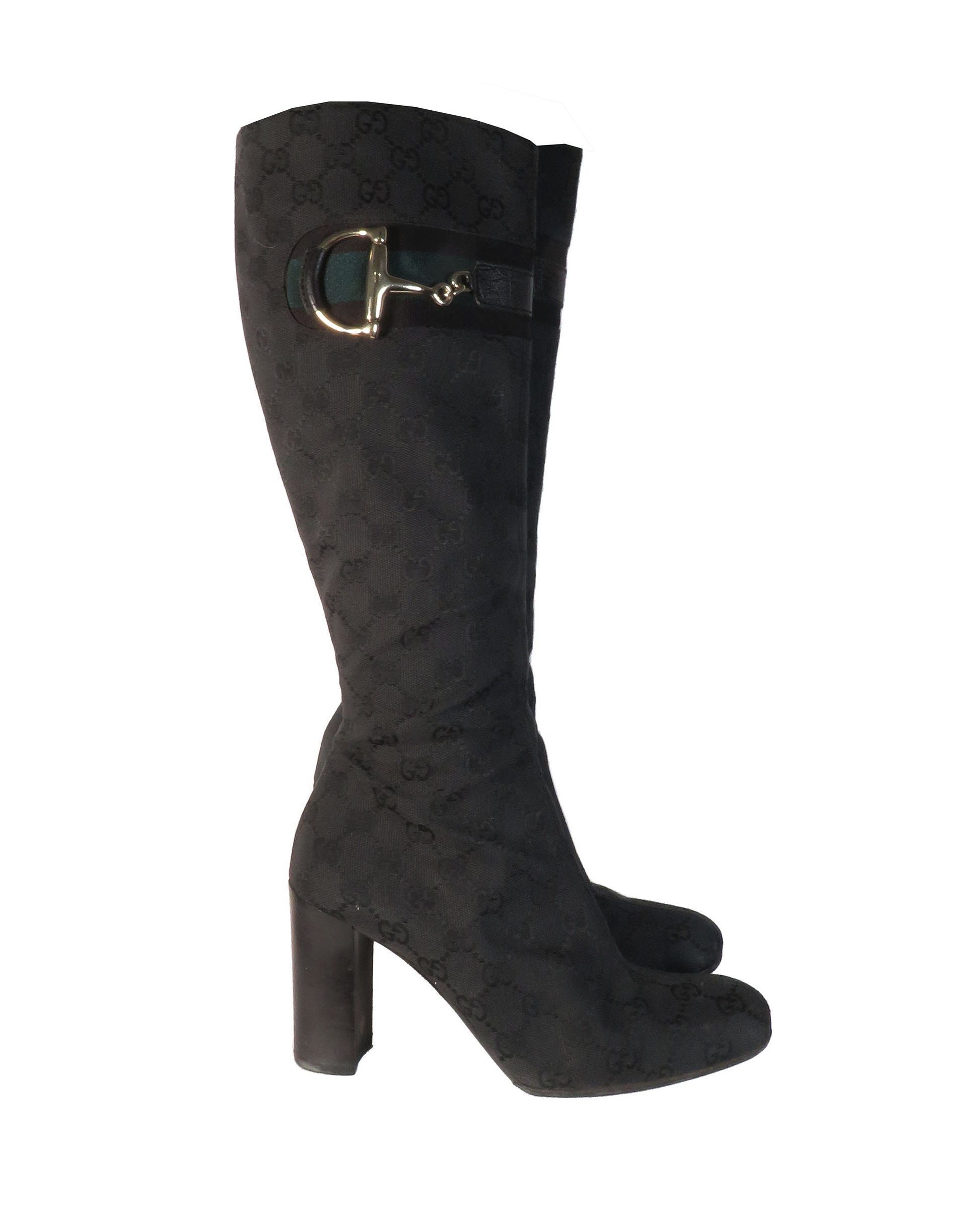 Black knee-high boot with gold buckle on a white background