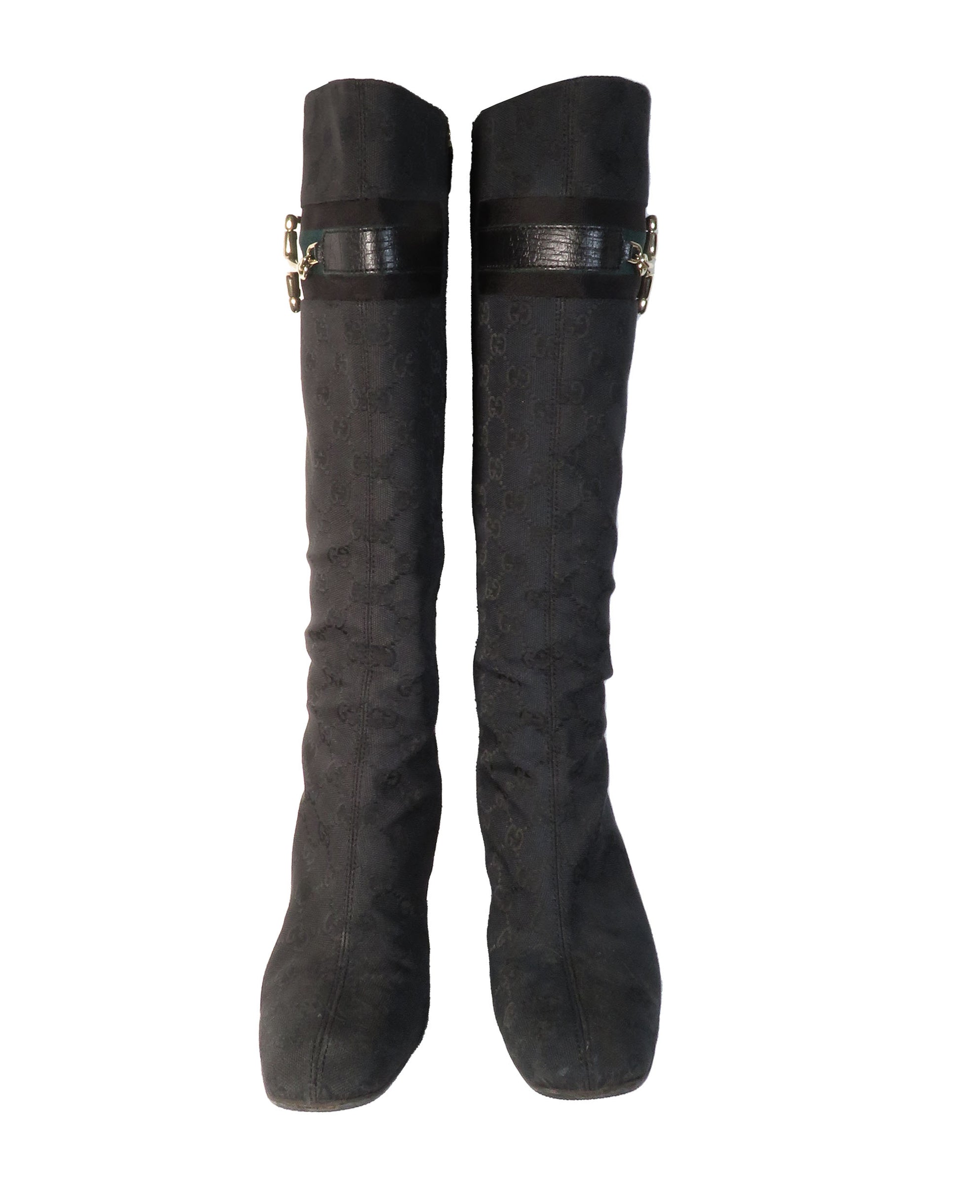 Pair of black knee-high boots on a white background