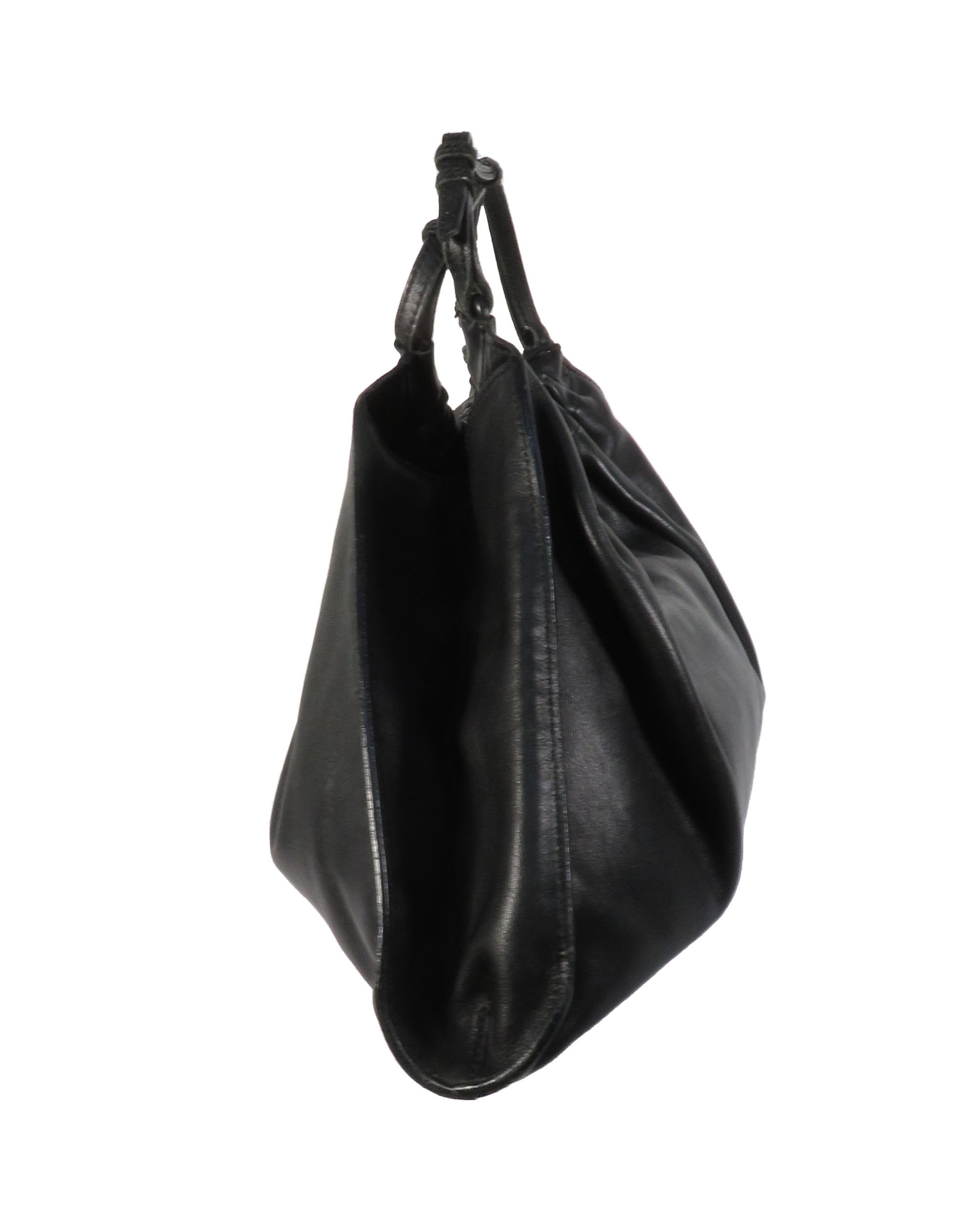 Black leather handbag on a white background