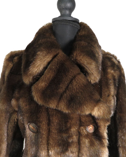 Brown fur coat on a mannequin with a white background