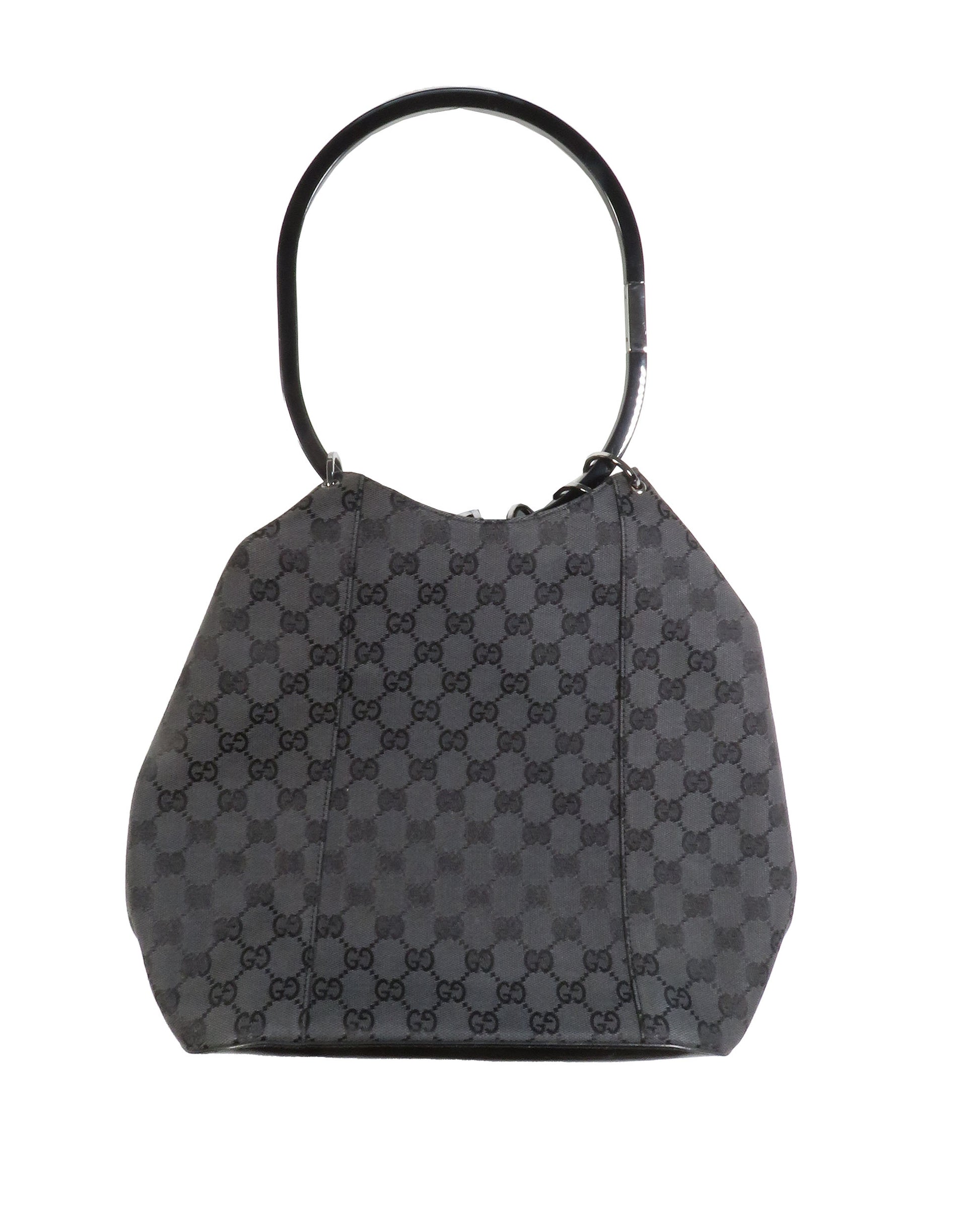 Gray checkered handbag with black handle on a white background