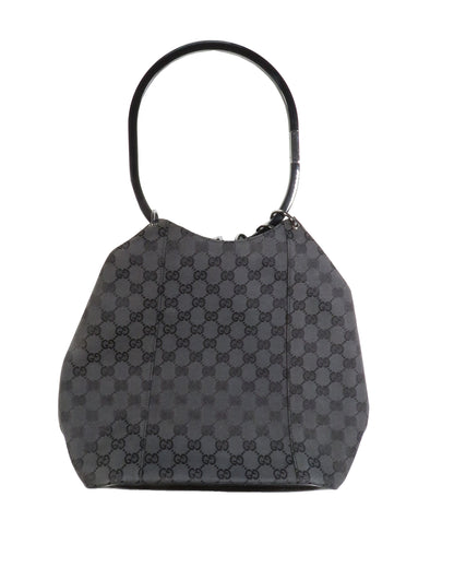 Gray checkered handbag with black handle on a white background