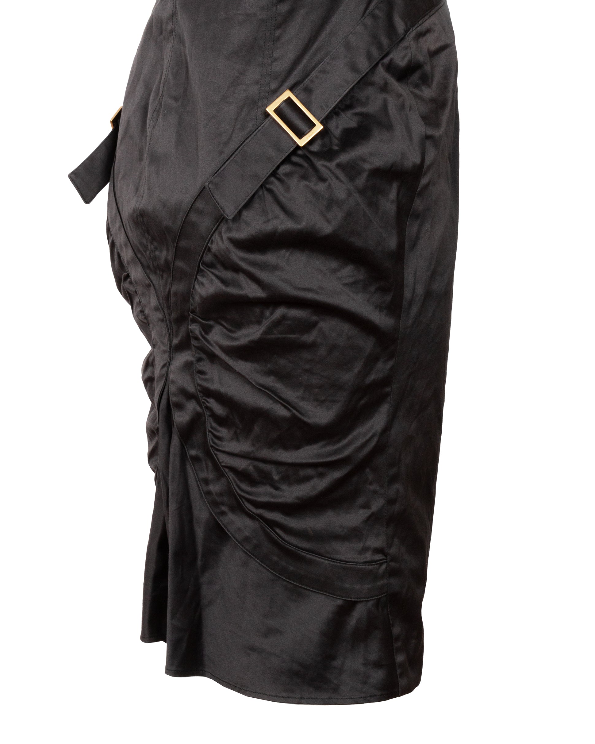 Black skirt with a gold buckle on a white background