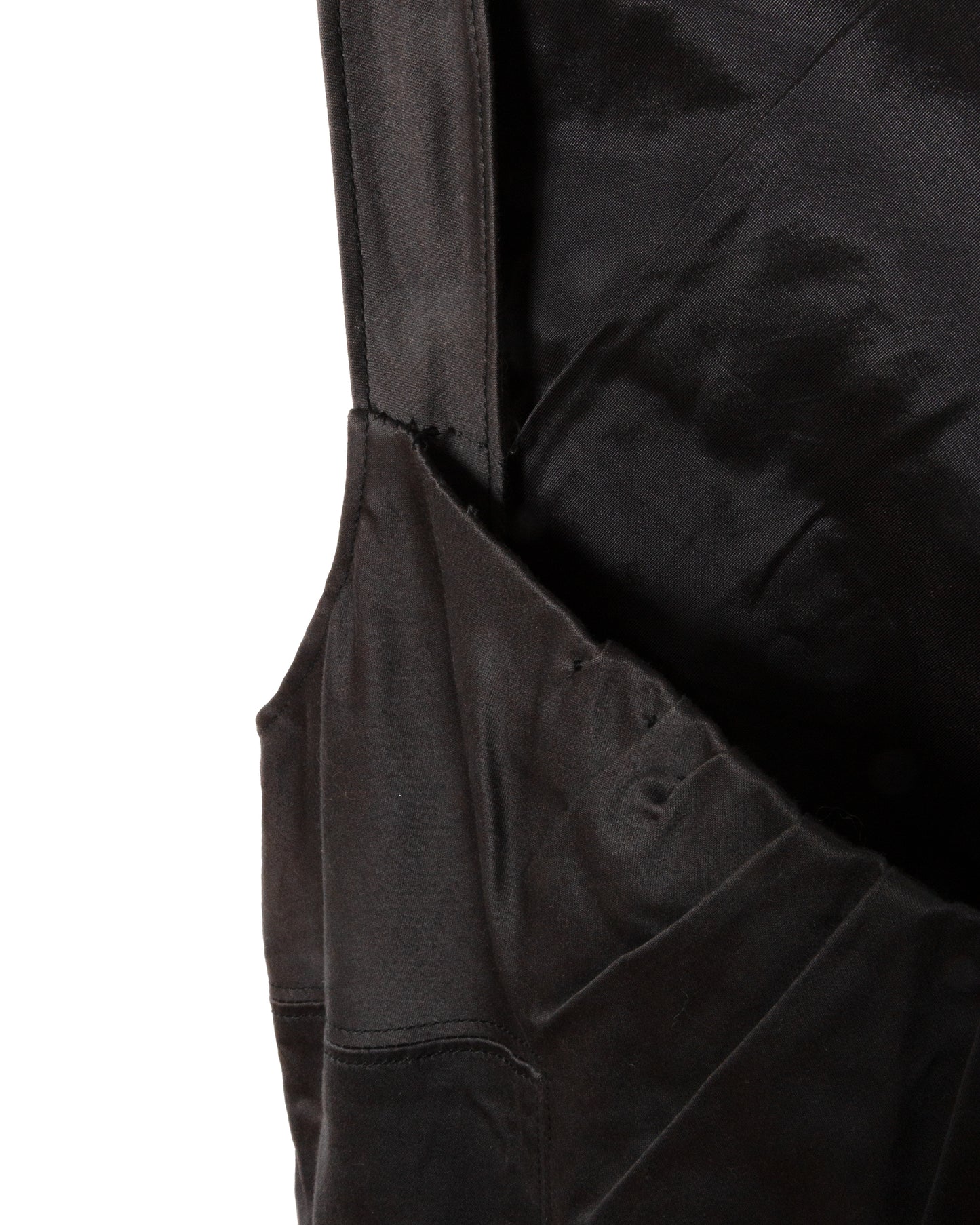 Close-up of a black garment with a pocket.
