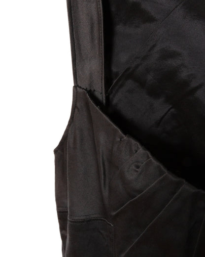 Close-up of a black garment with a pocket.