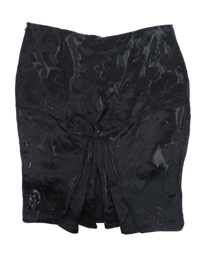 Black floral patterned skirt on a white background