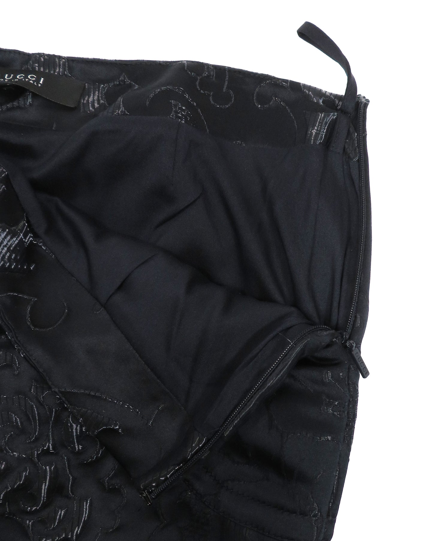 Black quilted jacket with floral pattern on a white background