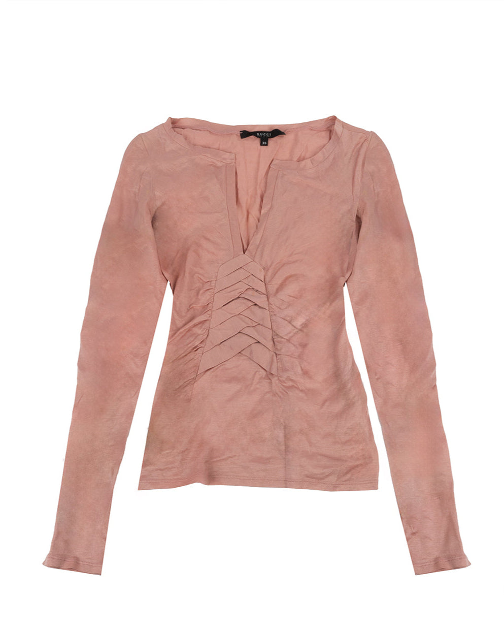 A long sleeve pink cotton top with a deep V-neckline and layered pleated detailing at the front.