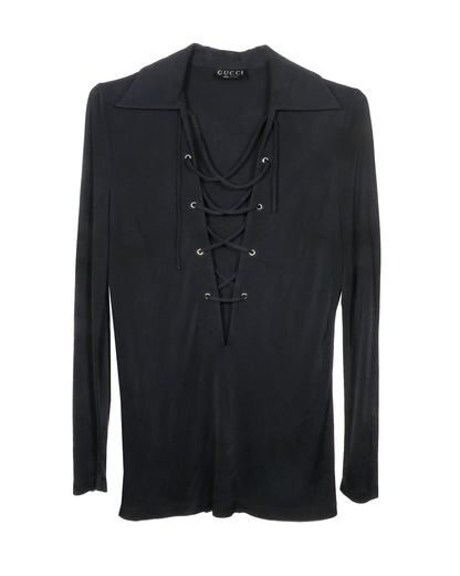 Black long-sleeve top with lace-up details on a white background