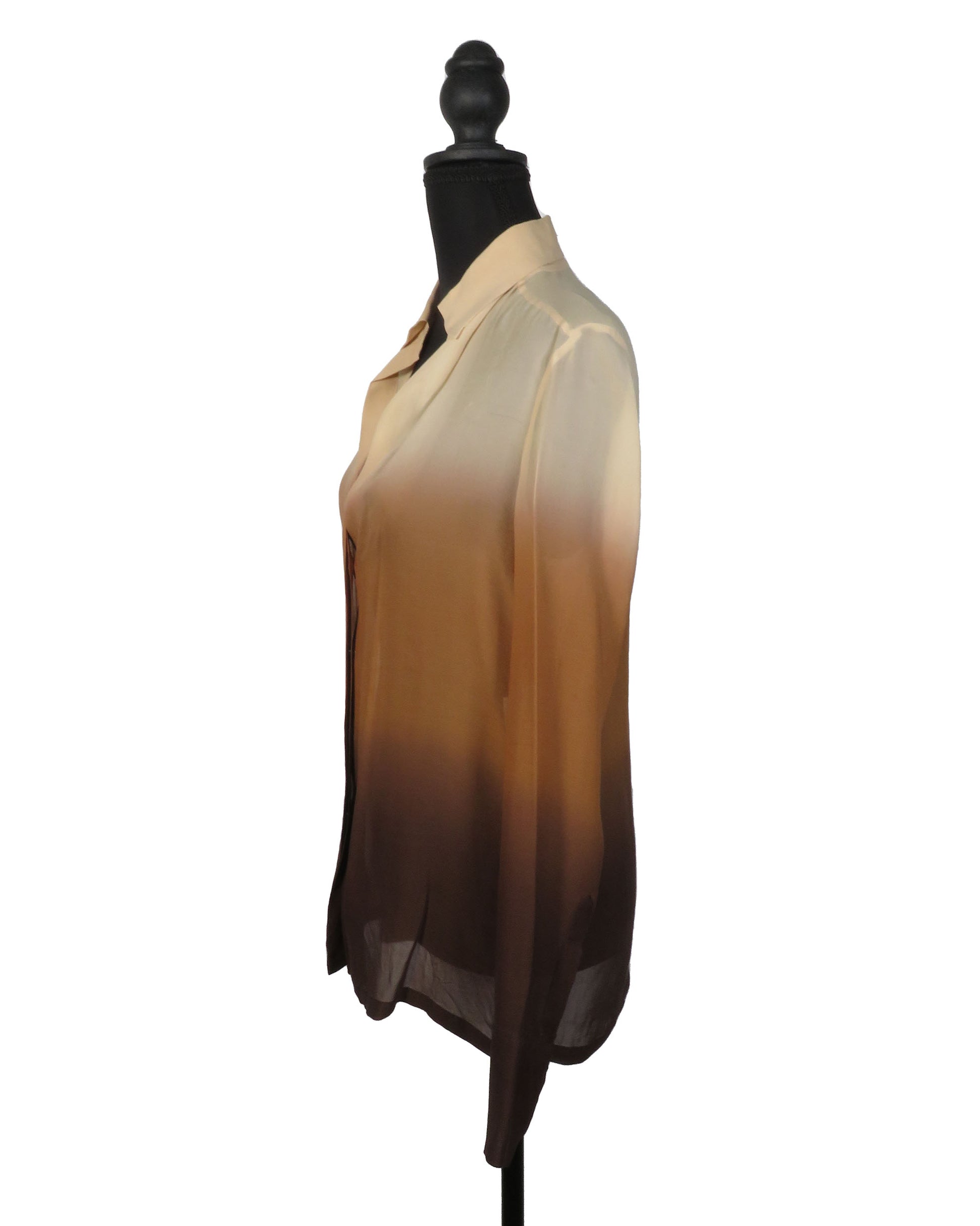 Mannequin wearing a beige to brown gradient scarf on a white background