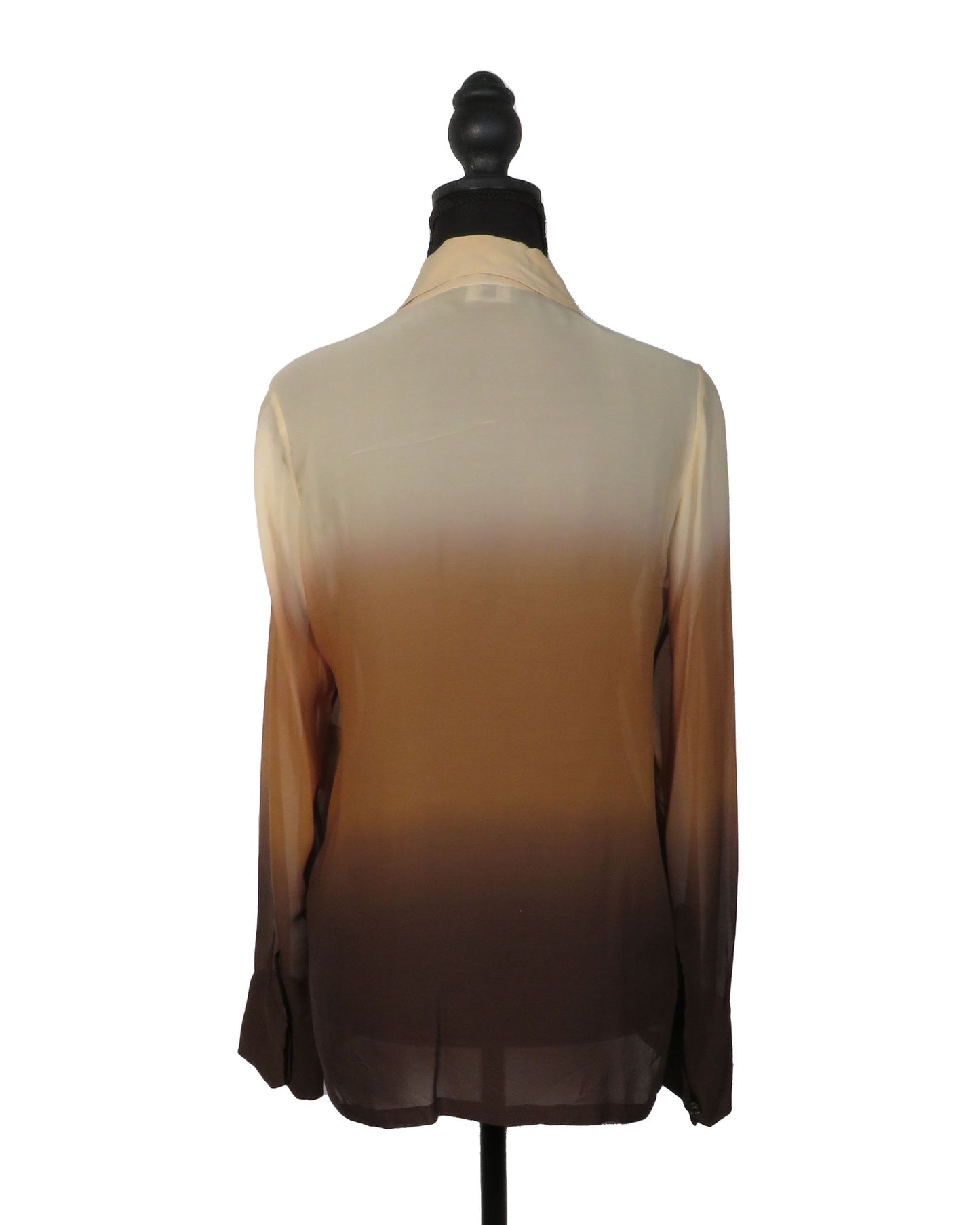 Sheer beige to brown gradient blouse on a mannequin against a white background