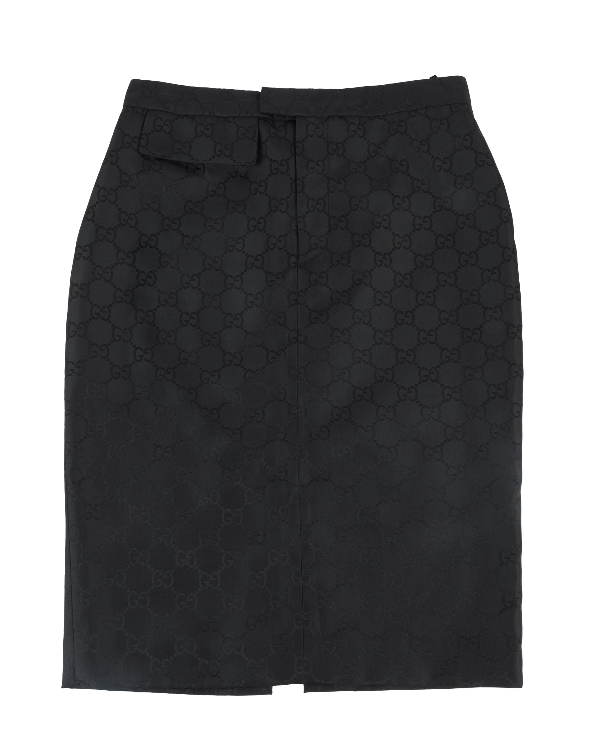 A black Gucci pencil skirt with an all-over tonal GG monogram jacquard pattern, featuring a structured silhouette and a back vent for movement.