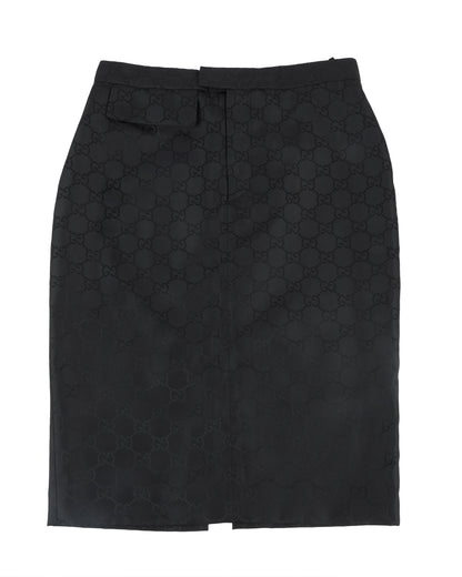 A black Gucci pencil skirt with an all-over tonal GG monogram jacquard pattern, featuring a structured silhouette and a back vent for movement.